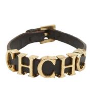 Pre-owned Brunt skinn Carolina Herrera armband