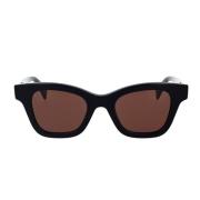 Geometriske solbriller med svart acetatramme og brune linser