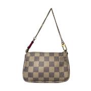 Pre-owned Beige skinn Louis Vuitton Clutch tilbehør