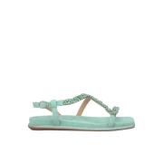 Flat sandal med skinnende stropp