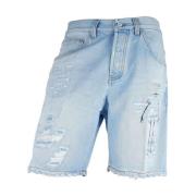 Slitte denim shorts med knappelukking