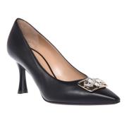 Court shoes in black leather