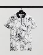 ASOS DESIGN relaxed polo in all over print-White