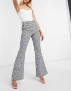 NA-KD houndstooth print flared trousers in black-Multi