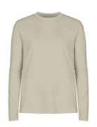 Clara Base Long Sleeve Sport T-shirts & Tops Long-sleeved Beige Röhnis...